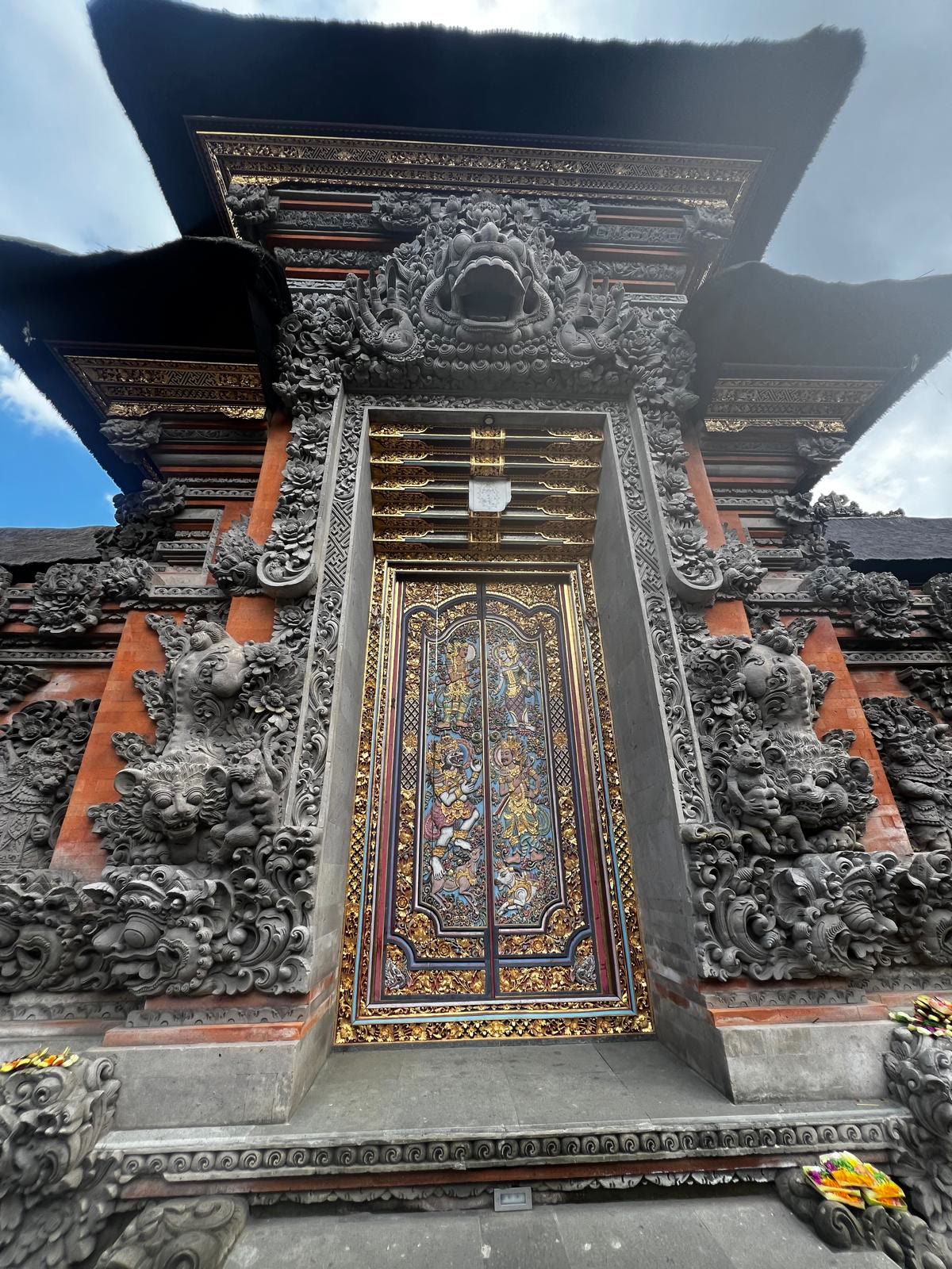 Ornate golden Balinese temple gateway