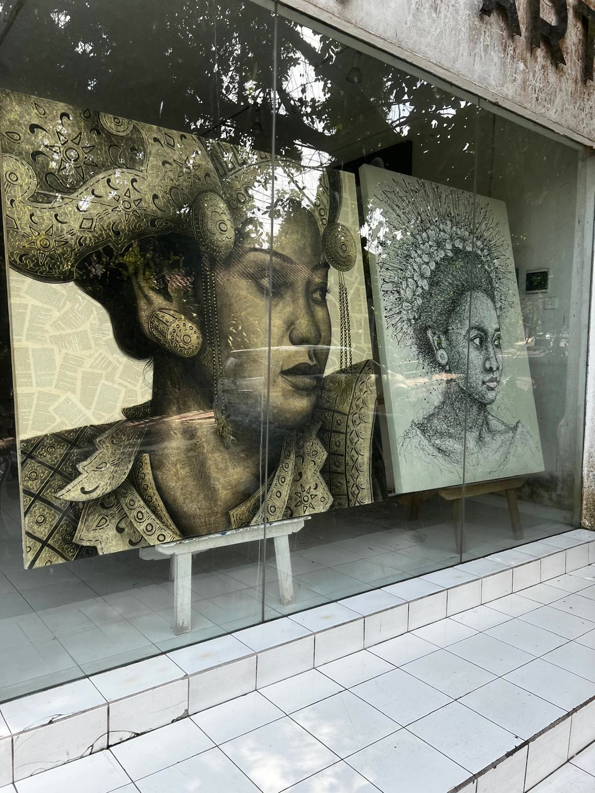Balinese portrait paintings in a shop window